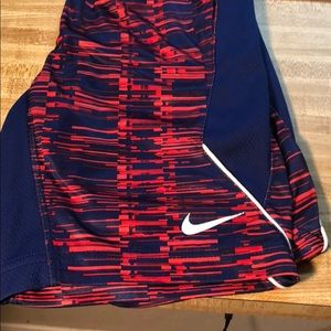 Blue and red/orange Nike shorts